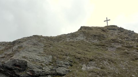 Drone shot of two hikers by a summit cross in Austria, Voralberg 08