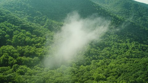 Drone flies through some clouds in the Appalachian Mountains of North Georgia.