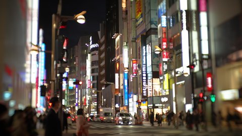 Shinjuku, Tokyo, Japan-March 18, 2021: This video shot a night view of Shinjuku in 50% slow motion using a lens that blurs the surroundings.
