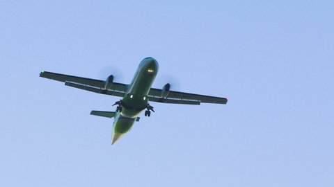 Local airlines, turbo propeller plane flies overhead. 
Propeller cargo plane 