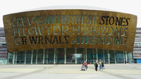 Cardiff, Wales, UK - 03.10.2021: The front of the Wales Millennium Centre in Cardiff Bay. People are walking past it.