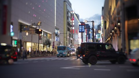 Shinjuku, Tokyo, Japan-March 18, 2021: This video shot the evening view of Shinjuku in 50% slow motion using a lens that blurs the surroundings.