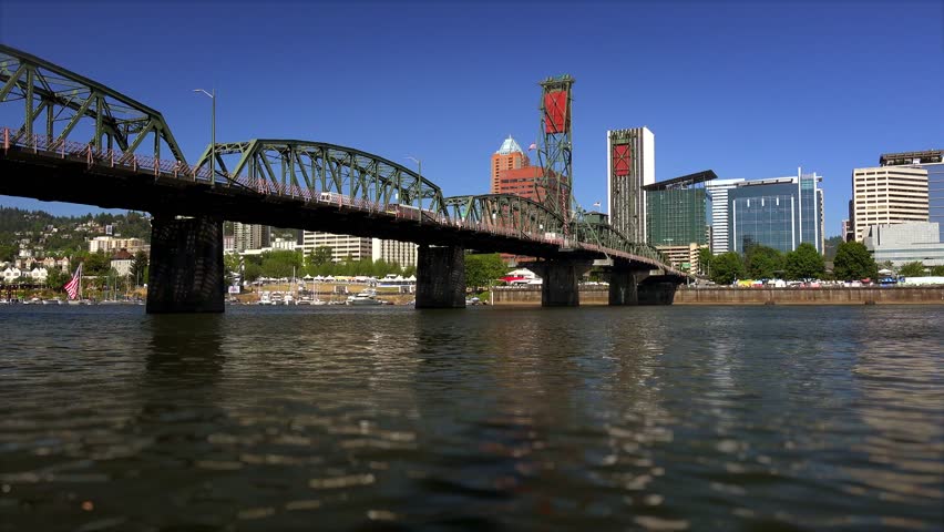 The Hawthorne Bridge crosses over the Willamette River and leads into Portland, Oregon