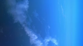 Vertical video of flight above the clouds in 4k