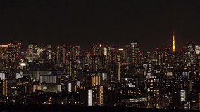 TOKYO, JAPAN : Aerial sunrise CITYSCAPE of TOKYO and MOUNT FUJI. Dawn sky, rising sun and buildings at downtown. Japanese metropolis and nature concept. Time lapse zoom out video, night to morning.