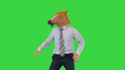 Medium shot. Front view. Business man in a horse mask dancing on a Green Screen, Chroma Key. Professional shot in 4K resolution. 070. You can use it e.g. in your medical, commercial video, business,