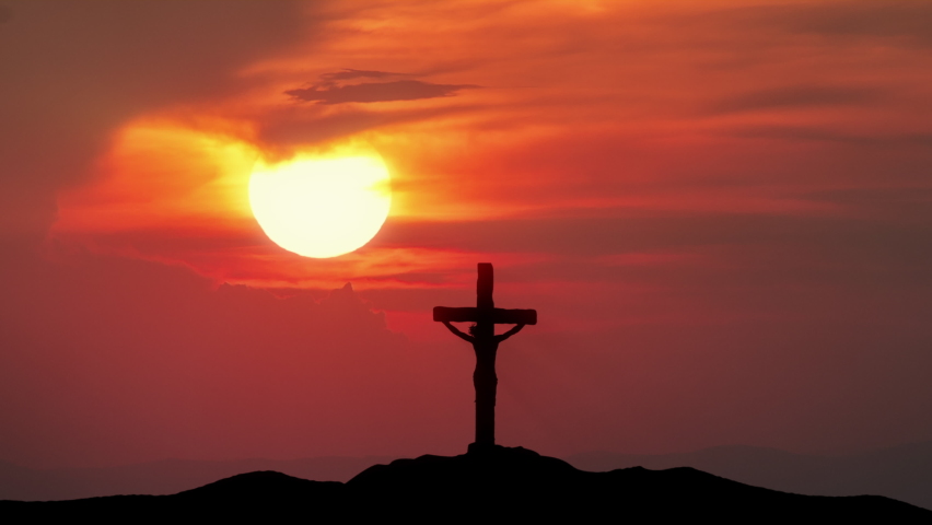 Cross of Jesus from Calvary hill. Big sun and moon with silhouette of Holy Cross and storm. Passing Time concept Royalty-Free Stock Footage #1069309840