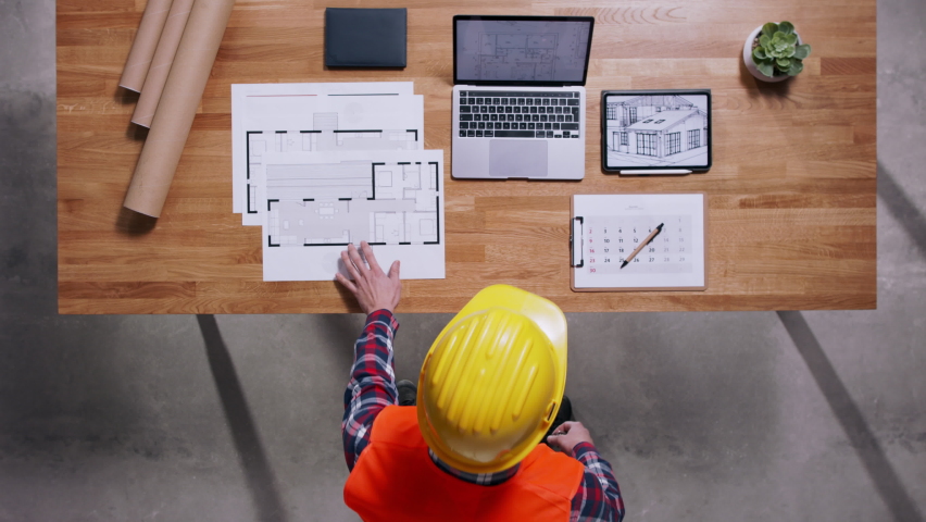 Top view of architect working on a housing project. Copy space. | Shutterstock HD Video #1069323061