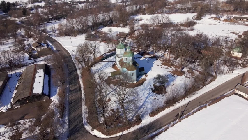 An old wooden church with green domes.  view from above.  Drone shooting