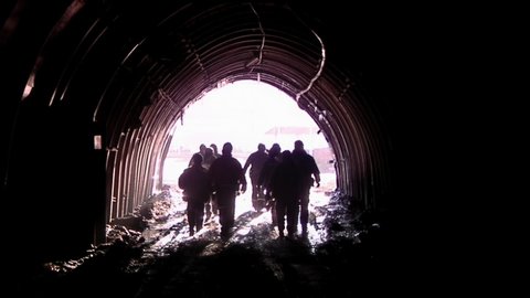 Silhouette of Miners leaving the Coal Mine in Patagonia, Argentina.