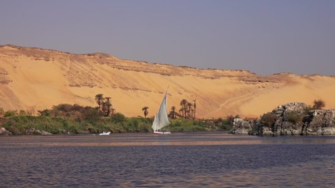 Beautiful landscape with felucca boat on Nile river near Aswan, Egypt, 4k