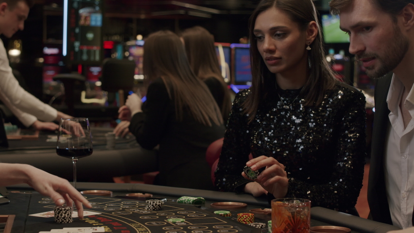 blackjack players place their bets at an elite casino. Gambling, nightlife Royalty-Free Stock Footage #1069339351