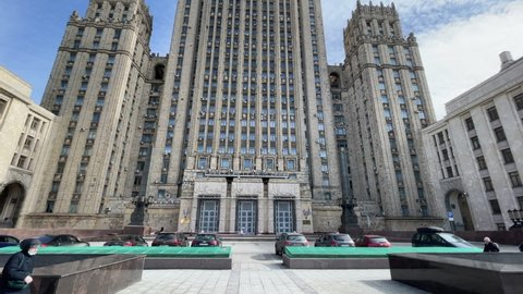 General view of the building and the door of the Ministry of Foreign Affairs of Russia with the coat of arms of the USSR in Moscow