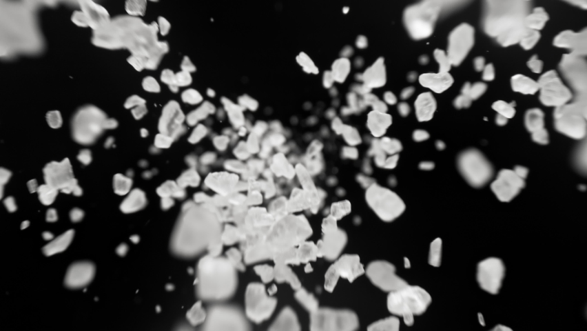 Super Slow Motion Detail Shot of Salt Falling on Black Background at 1000fps. Royalty-Free Stock Footage #1069354915