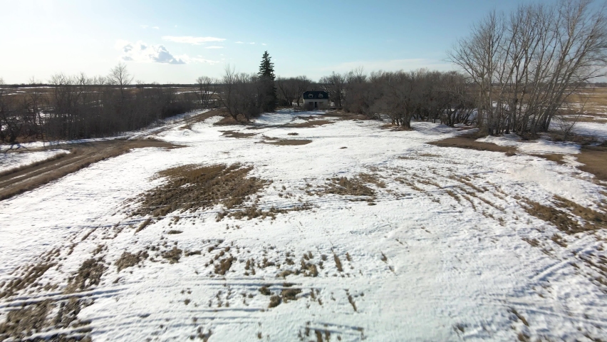 An aerial view of old dilapidated farming homesteads built by the original settlers of the prairie province of Saskatchewan, Canada. 