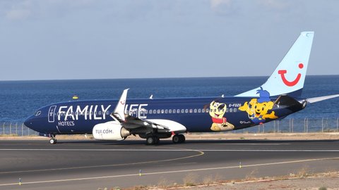 Canary Islands, Spain 06.02.2019 TUI Airways passenger aircraft, G-FDZG a Boeing 737-800 NG with the Family Life Hotels livery accelerating on the runway. High quality 4k footage