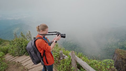Man photographer making photo at Kew mae pan nature trail at Doi Inthanon national park ,Chiangmai