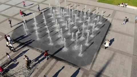 Drone video City fountain in the square, air view of city vertical fountains in 4k resolution, Nikolaev fountains Ukraine, people walk in the square