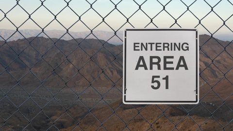Entering Area 51 Sign On A Fence At The Military Base In The Nevada Desert At Sunset