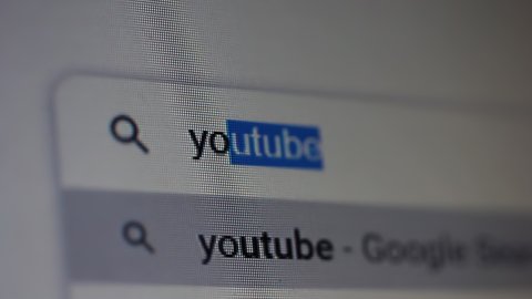 Buenos Aires, Argentina - March 2021: Searching for "Youtube" in an Internet Search Engine on a Computer. Close Up. 4K Resolution.