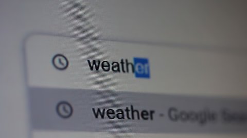 Buenos Aires, Argentina - March 2021: Searching for "Weather" in an Internet Search Engine on a Computer. Close Up. 4K Resolution.