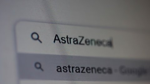 Buenos Aires, Argentina - March 2021: Searching for "Astrazeneca" COVID-19 Vaccine in an Internet Search Engine on a Computer. Close Up. 4K Resolution.