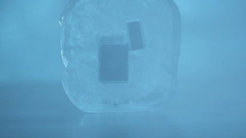 CU Cigarette Lighter frozen in ice cube.