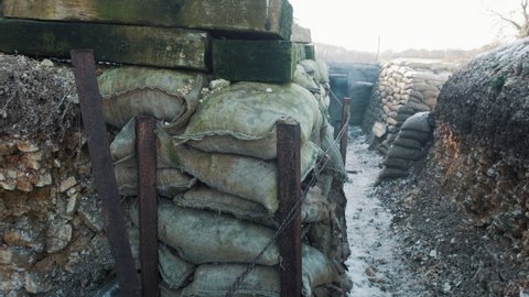 A first world war trench view with wooden planks and sand bags in France during ww1