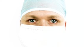 close up portrait of a surgeon or doctor with white mask.4K video.white background