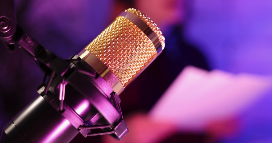 recording podcast - podcaster radio station host working in studio. microphone closeup Royalty-Free Stock Footage #1069407631