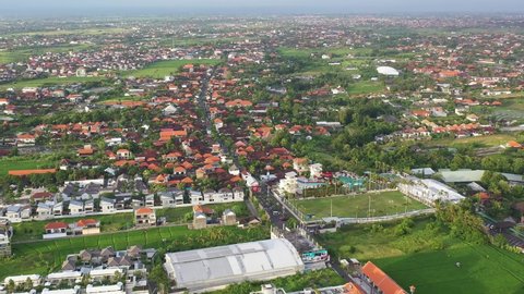 Aerial drone footage of the famous Canggu village, a trendy place north of Seminyak in Bali, Indonesia.