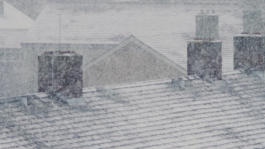 Chimneys of a residential area in London during a heavy snowfall. Royalty-Free Stock Footage #1069416454