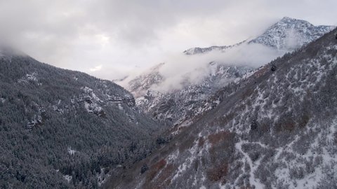 Mountain shrouded in clouds in American Fork Canyon, Wasatch Mountains, Utah. Aerial view