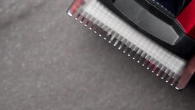 A close up macro clip of professional quality barbers clippers blades in 100fps slow motion shot in 1080p	