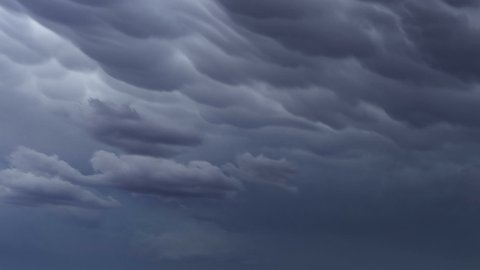 Formation of Mammatus clouds dramatic sky background, timelapse