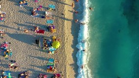 Croatia. Aerial view on the beach and people. Vacation and adventure. Beach and blue water. Top view from drone at beach and azure sea. Travel and vacation video.