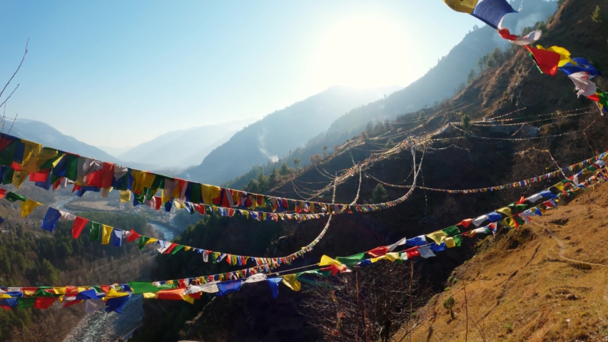 Colorful Buddhist Bhutanese Tibetan prayer flag covering the mountains at Pangan Nyingma Monastery in Patlikuhal village near Manali, Himachal Pradesh, India | Shutterstock HD Video #1069436164