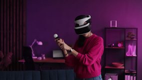 Female in vr glasses training in virtual reality. Young woman doing sports, playing tennis video game. Gamer having fun with new technology console with virtual reality experience. Technology concept.