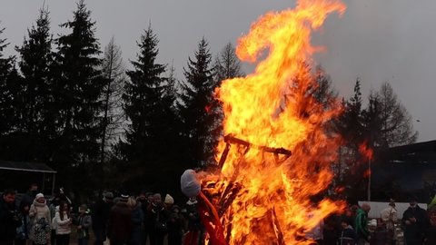scarecrow burning at Maslenitsa party in Dudutki.Minsk.Belarus - March 10 2021