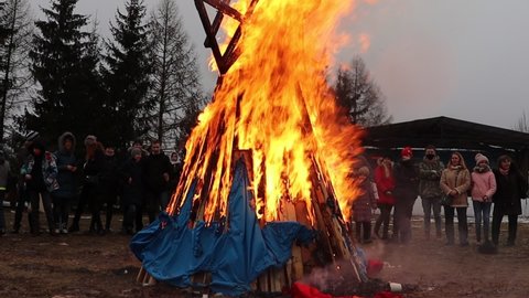 scarecrow burning at Maslenitsa party in Dudutki.Minsk.Belarus - March 10 2021