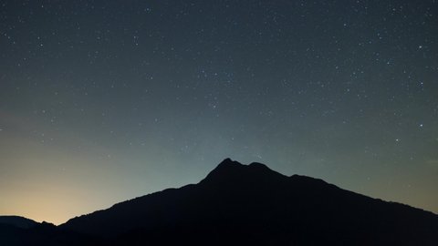 4K Time Lapse. Nature Video Scene of Milky Way Night Starry Sky With Glowing Stars Over Mountain Bright Glow Of Planets Saturn and Jupiter In Sky Among The Milky Way Galaxy Stars. Dark Sky and star.