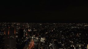 TOKYO, JAPAN : Aerial sunrise CITYSCAPE of TOKYO and MOUNT FUJI. View of rising sun and buildings around Shibuya. Japanese city life and nature concept. Time lapse tracking video, night to morning.
