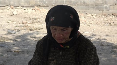 Old Syrian woman sheds tears in pain for losing her children in the war. The war in Syria.
Aleppo, Syria February 13, 2021
