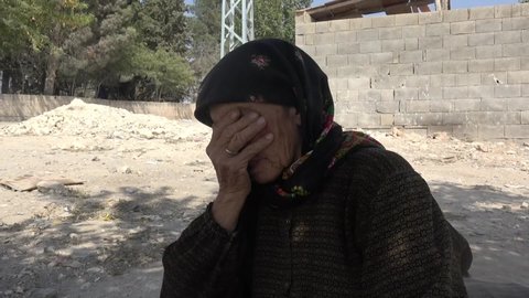 An old woman sheds tears. Syrian refugee crying because of the war.
Aleppo, Syria February 13, 2020