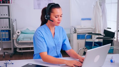 Professional health therapist prescribing treatments for patients during telehealth using headset, answering calls. Healthcare physician in medicine uniform, doctor nurse helping with appointment