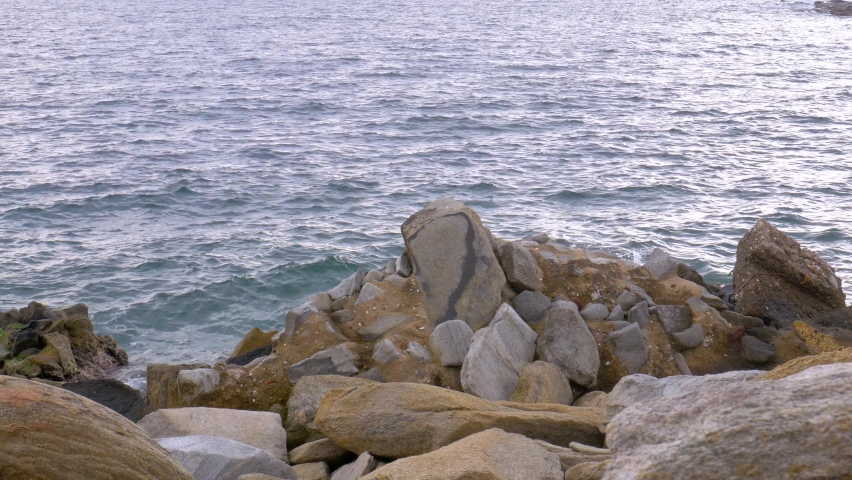 Beautiful view of the sea behing some rocks