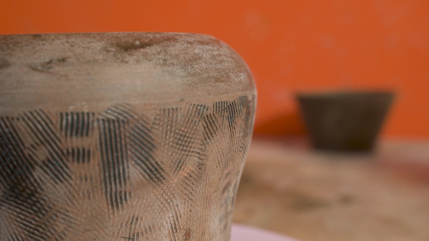 Close-up of a ceramic bowl glazed with primitive techniques  FDV
