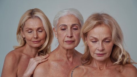 Cinematic footage of three senior women posing in lingerie. Conceptual video about body positivity and self acceptance