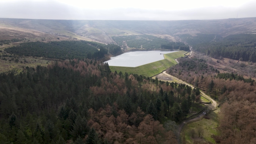 Aerial Drone View Forest Hike In Peak District West Yorkshire Holmfirth Yateholme With Walking trail and Misty Hills In Background