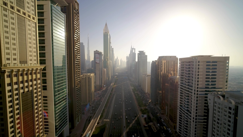 Dubai, United Arab Emirates - 16 March 2021: Aerial view of Sheikh Zayed road crossing the financial district with tall skyscrapers in Dubai downtown, United Arab Emirates.